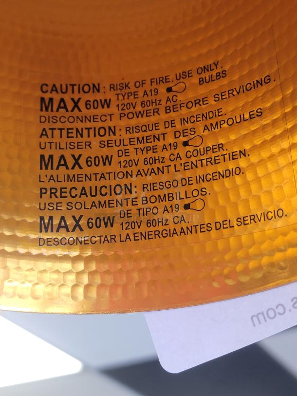 Set of 14 Tom Dixon Hammered Metal Funnel Pendant Lights. Matte black exterior, hammered gold interior. Max 60W, Type A19 bulbs.