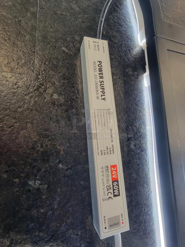 Jack Daniel’s LED Neon Sign, bottle-shaped, black finish, white glow, Old No. 7 label, JLV-24060KA-W, with power supply.