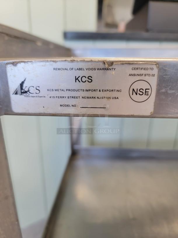 KCS stainless steel 3-tier utility cart, NSF-certified, durable, with push handle and industrial casters, label visible.