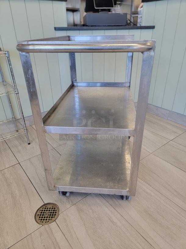 KCS Metal Products 3-Tier NSF Utility Cart, stainless steel, with push handle and industrial casters, for heavy-duty use.