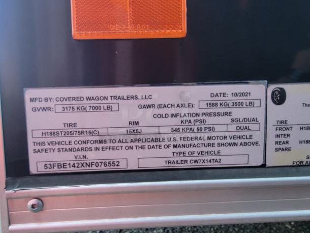 2021 Manufactured label for Covered Wagon Trailers LLC. GVWR: 7000 LB. VIN: 53FBE142XNF076552. Model: CW7X14TA2.