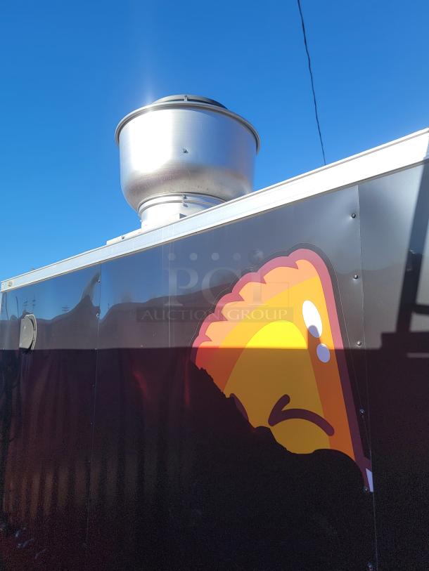 2021 Covered Wagon 16' mobile food trailer, metallic exterior with logo, roof vent visible, excellent condition.