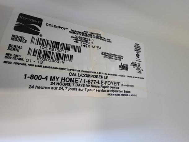Label inside Kenmore Coldspot fridge showing model 106.62159111, serial VS30395319, manufactured 01-13. Includes service contact info.