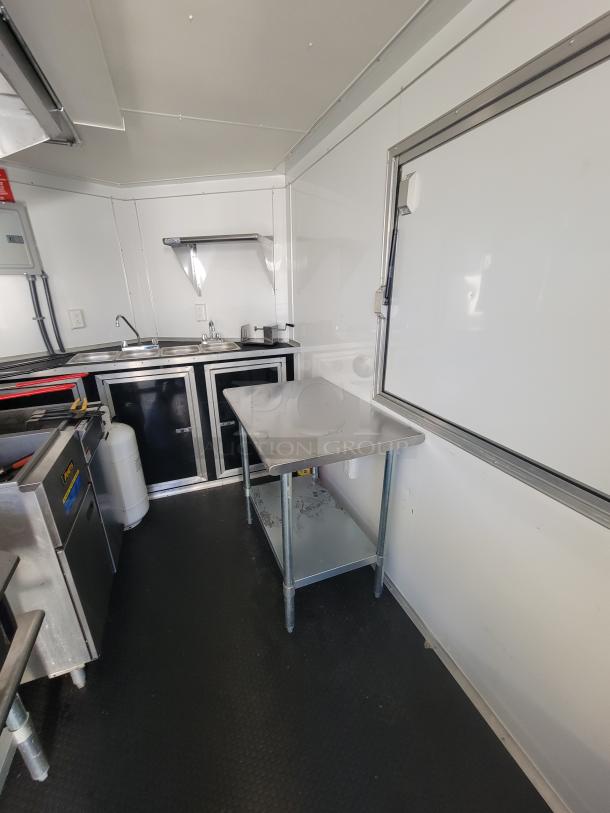 2021 Covered Wagon 16' mobile food trailer, commercial kitchen, flat top griddle, dual fryers, prep table, non-slip floor.