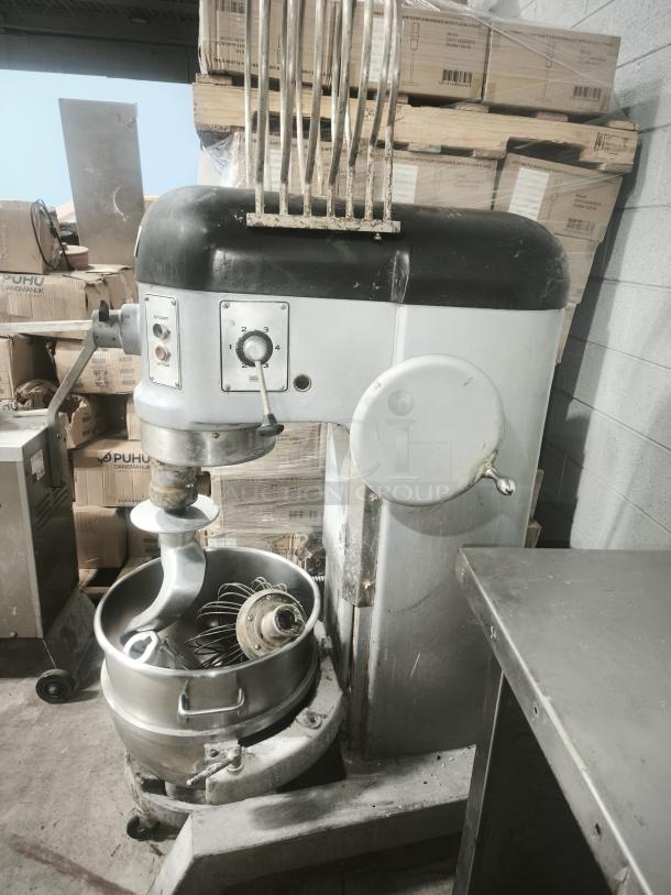 Hobart H-600 60 Qt Mixer in used condition, featuring a large metal bowl with attachments, control panel, and industrial design.