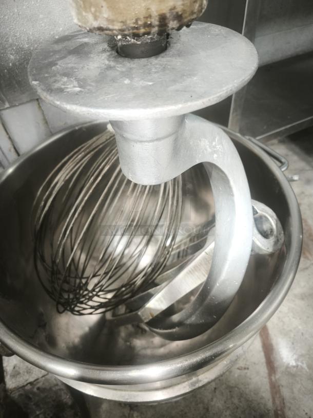 Hobart H-600 60 Qt Mixer with stainless steel bowl and attachments, showing light wear, ideal for commercial use.