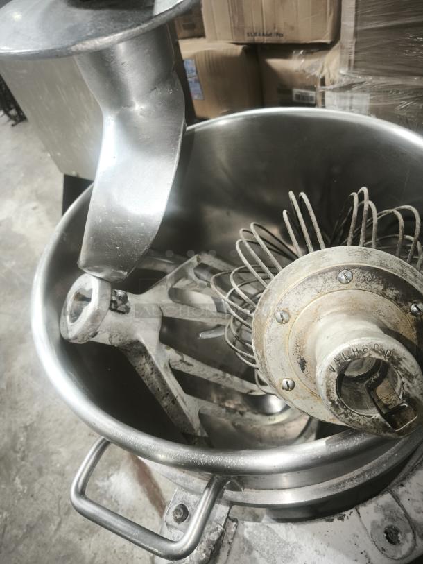 Hobart H-600 60 Qt Mixer, stainless steel bowl, dough hook and whisk attachments, visible wear, model marking "H-600".