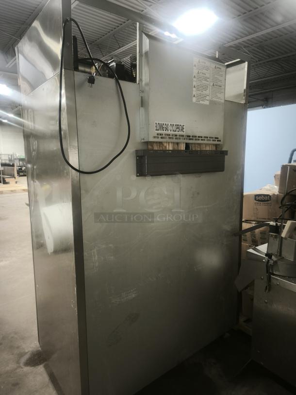 Turbo Air M3F47-2-N two-section reach-in freezer, solid doors, 115v, stainless steel, used, cyclopentane gas label visible.
