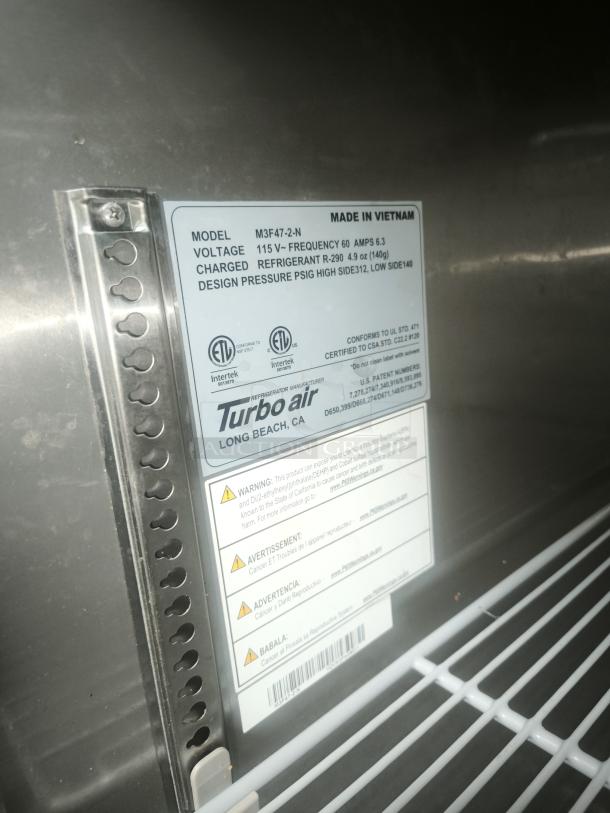 Turbo Air M3F47-2-N reach-in freezer label, showing voltage, refrigerant type, and warning information.