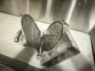 Hobart Pelican Head cheese shredder mixer attachment with shredding blade, metal body, visible wear.