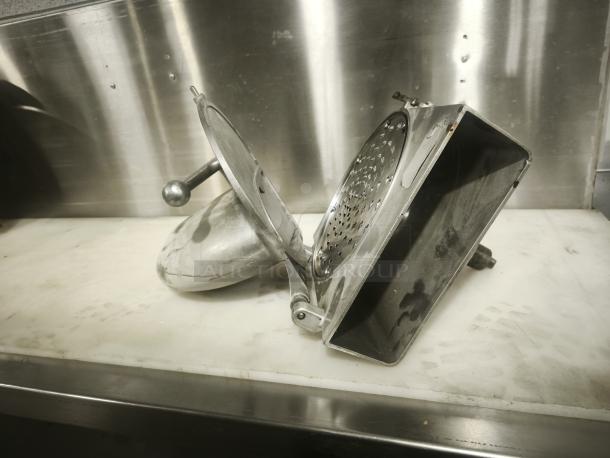 Hobart Pelican Head cheese shredder mixer attachment with shredding blade, in used condition, stainless steel construction.