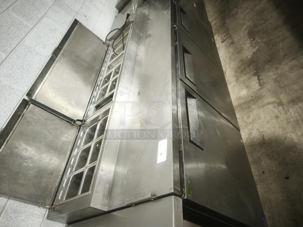 True TPP-93 93" 3-Door Refrigerated Pizza Prep Table, stainless steel, spacious interior with label and minor wear.