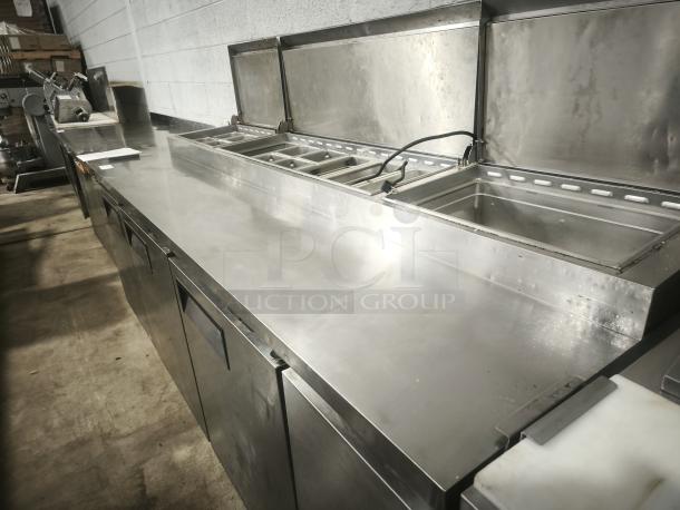 True TPP-93, 93" 3-door refrigerated pizza prep table. Stainless steel, top compartments, used condition.