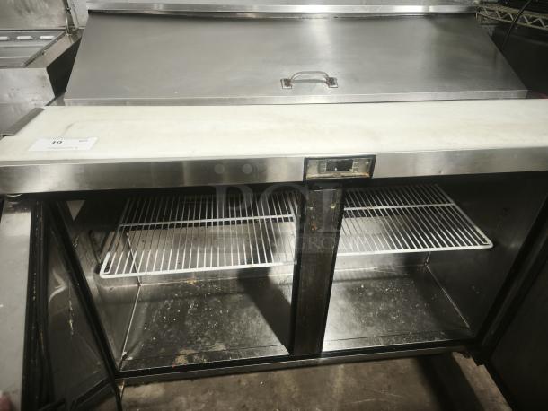 48" stainless steel salad bar refrigerator with cutting board, shelves, and ETL certification; used condition.