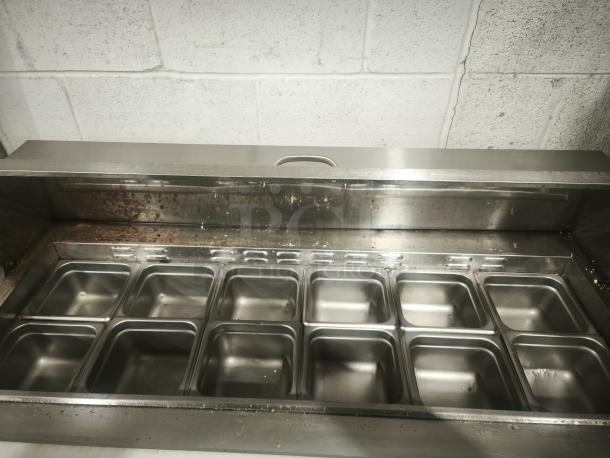 48'' stainless steel salad bar refrigerator with multiple food prep compartments, ETL certified, used condition.