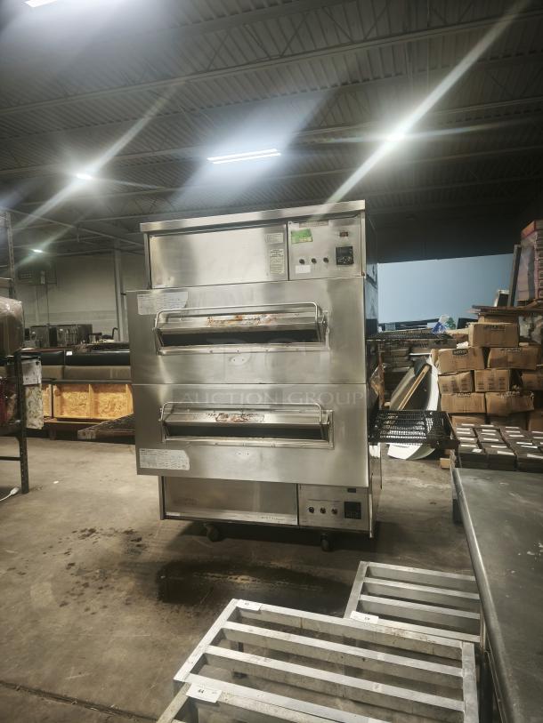Middleby Marshall PS360 doublestack gas pizza oven conveyor in industrial setting, stainless steel, visible control panel and conveyor belts.