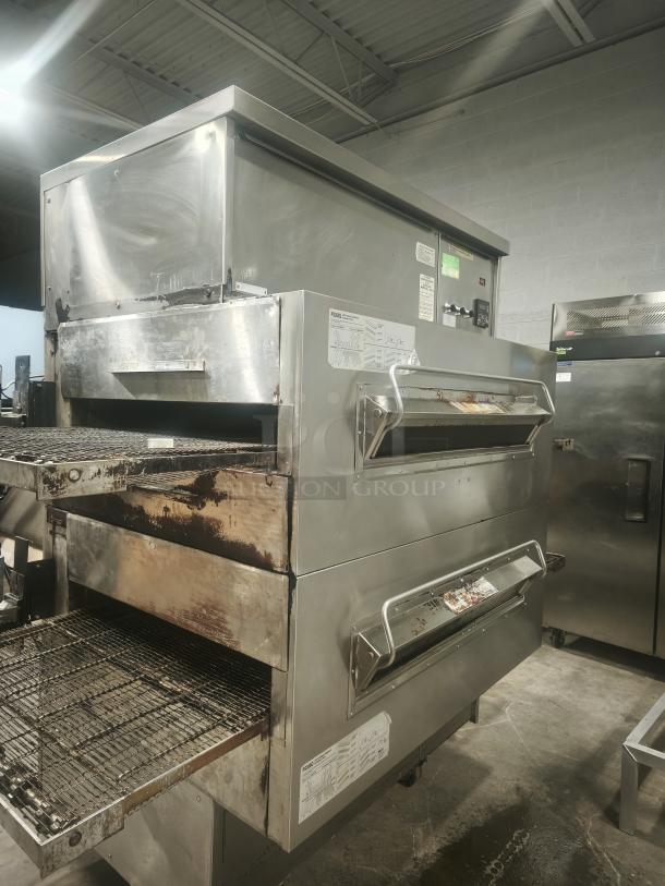 Middleby Marshall PS360 doublestack gas pizza oven conveyor in used condition, visible labels showing model and specifications.