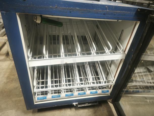 Minus Forty glass door countertop freezer, Model 07-csgf-x1-frc2, blue exterior, dual-shelf, fair condition, interior labeling.