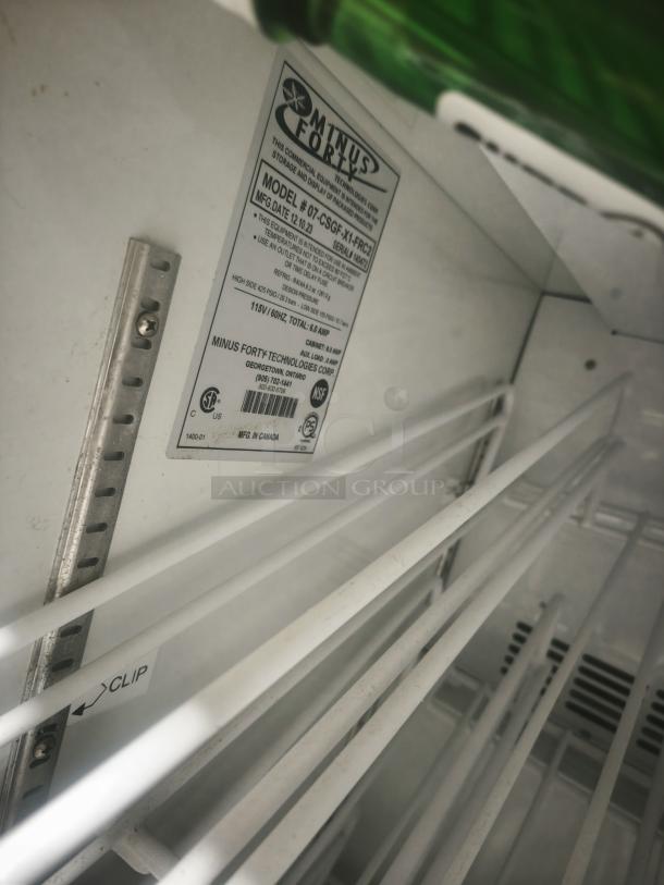 Minus Forty countertop freezer, model 07-csgf-x1-frc2, glass door, adjustable shelves, used condition, label visible.