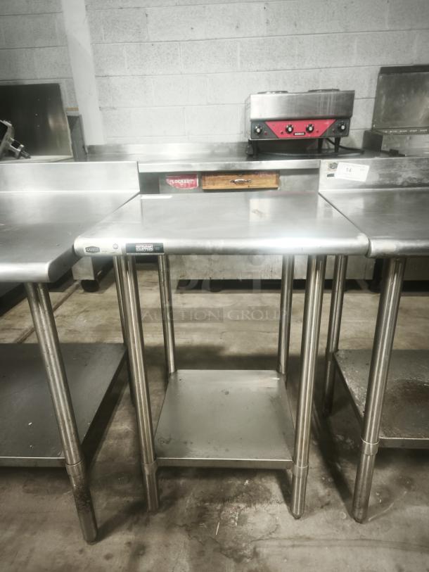 Economy stainless steel prep table, 24x24x36 inches, with sturdy legs and lower shelf. Ideal for commercial kitchens.