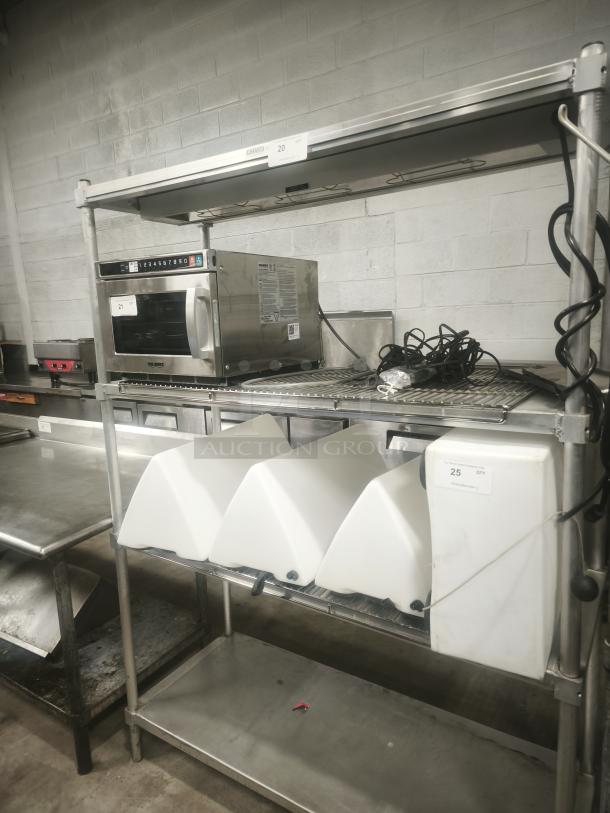 Heavy-duty steel shelving unit, three-tier, commercial-grade, holds kitchen equipment. Visible labels: "20" and "25."