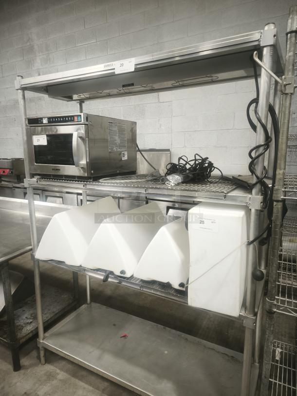 Heavy-duty three-tier steel shelving in good condition, featuring solid construction and three spacious shelves.