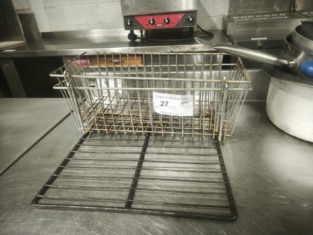 Commercial-grade stainless steel wire basket with a chrome-plated finish, in good condition. Auction tag reads "27 QTY."