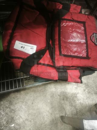 Red Commercial Products ProServe insulated pizza & food delivery bag with clear ID window, in used condition, on metal shelf.