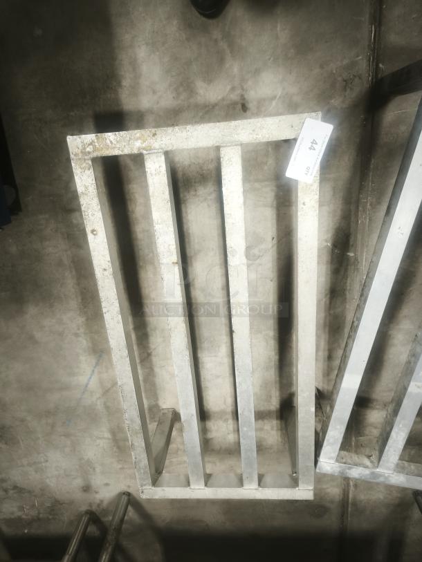 Aluminum Dunnage Rack for commercial storage, rectangular with slatted top. Used condition, auction tag indicating lot 44.
