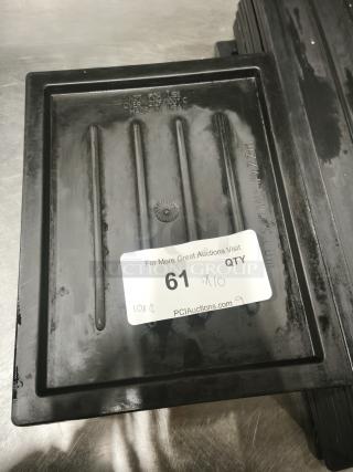 Black plastic tray or lid, medium size, rectangular with ribbed interior. Marked "Not for use over 212°F, Made in USA."