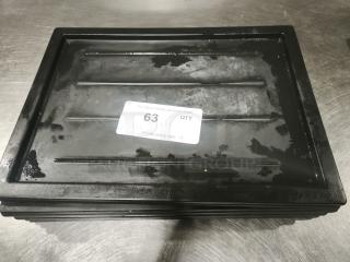 Black multi-purpose plastic tray or lid shown on a metal surface. Sticker with auction info and item number 63 visible.
