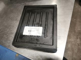 Black plastic tray or lid with ridged surface. Good condition. Auction label reads "66 QTY 10, PCIauctions.com".