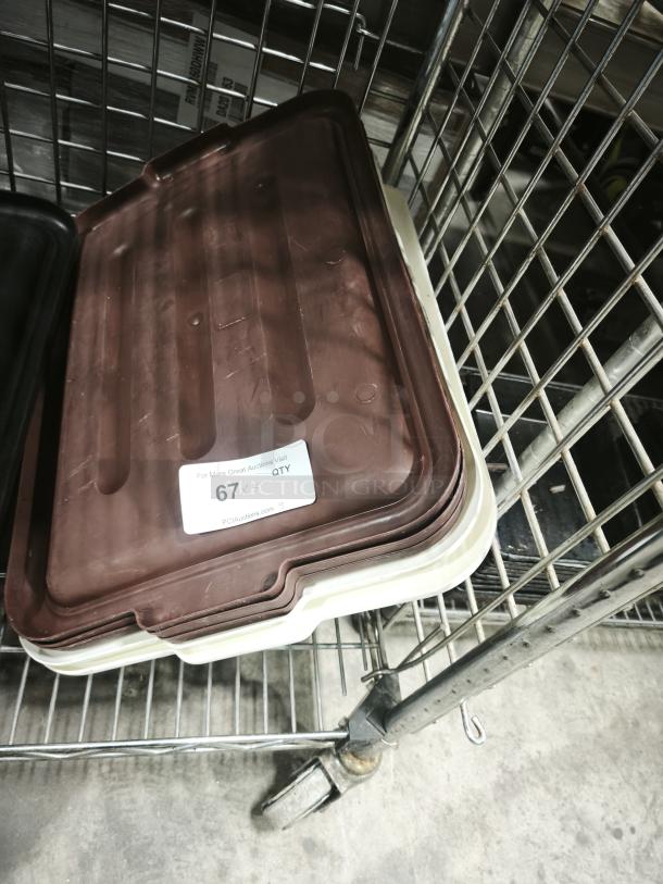 Plastic commercial bus tub lid, brown, stackable, used, label: "67 x 5 QTY".