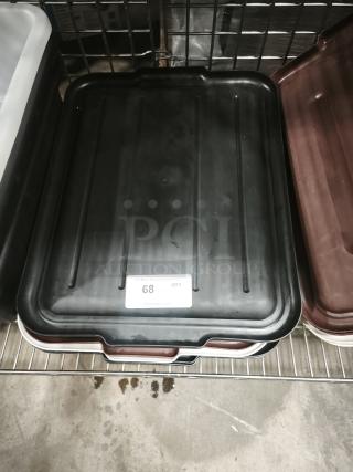 Black plastic commercial bus tub lid with label number 68, indicating quantity. Sturdy and functional for storage use.