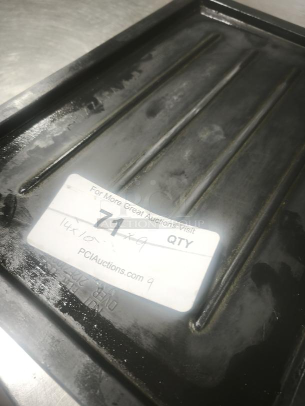 Black plastic tray or lid, model 14, with textured surface. Label reads "71 QTY 14x10-9" from PCIAuctions.com. Used condition.