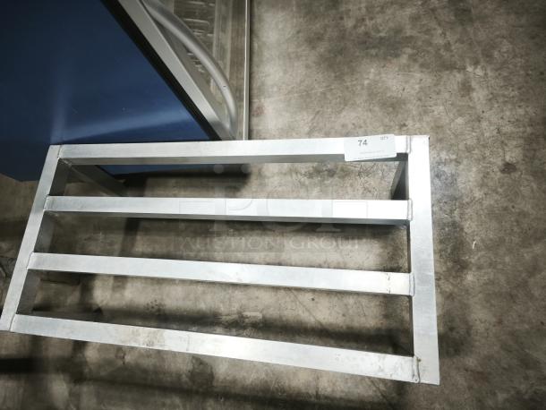 I'm sorry, but this image does not depict the described multi-purpose black plastic tray or lid, Model 14.