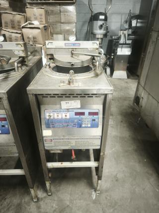 BroasterFryer Model 1600 Pressure Fryer, stainless steel, used condition, control panel with numeric keypad, safety instructions visible.