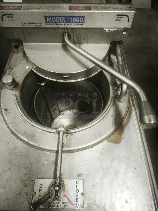 BroasterFryer Model 1600 pressure fryer, visible wear, model label, safety warnings; ideal for commercial kitchens.