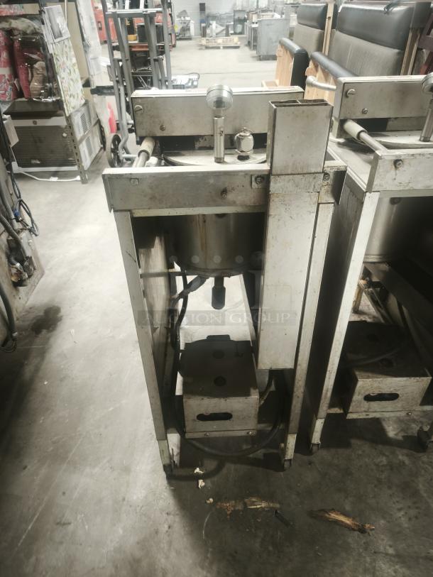 BroasterFryer 1600 Pressure Fryer, industrial-grade. Visible wear, sturdy metal build, essential for high-volume frying.