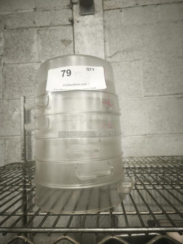 Clear 2 Qt. round food storage container, stack of five, visible capacity markings, auction label "79 x5".