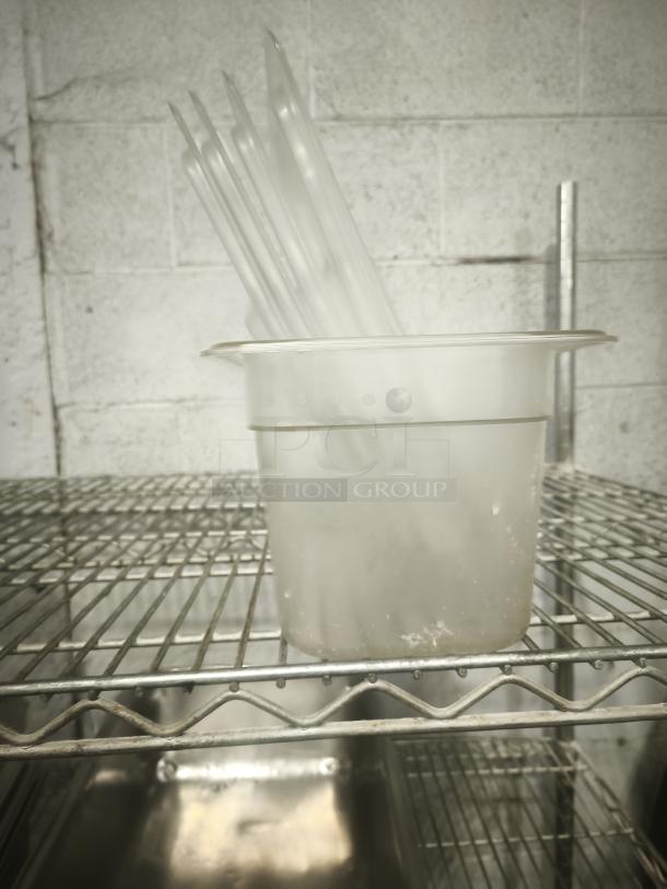 Translucent plastic third-size steam pan with lids, in good condition, displayed on a metal shelf.