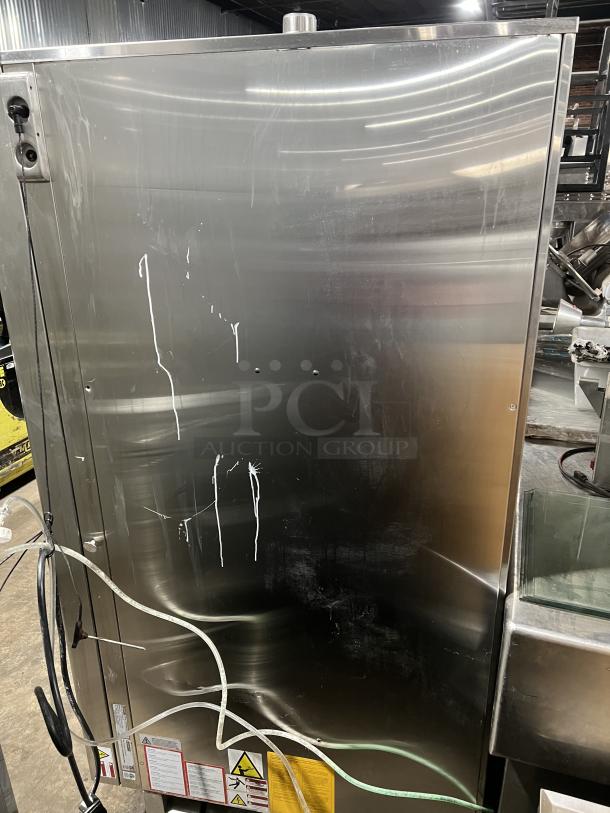 Blodgett BLCT202 commercial stainless steel combi oven, natural gas powered, shown with exterior markings and attached cables.