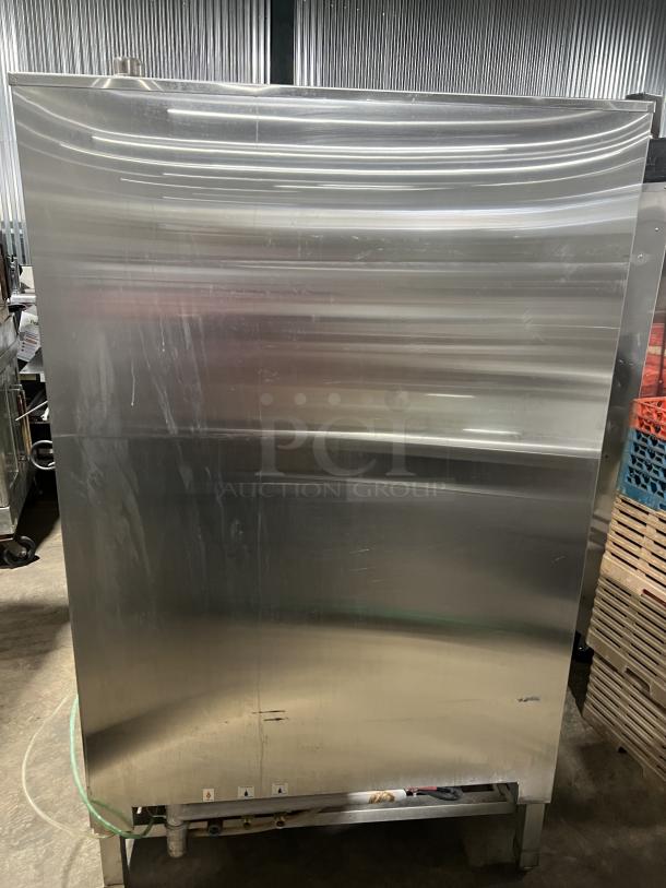 Blodgett BLCT202 commercial stainless steel combi oven, natural gas powered, on legs. Features visible wear. Model: BLCT202.