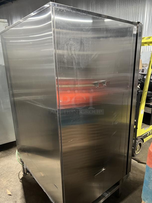 Blodgett BLCT202 stainless steel combi oven, natural gas-powered, on legs, visible wear, model and serial numbers visible.