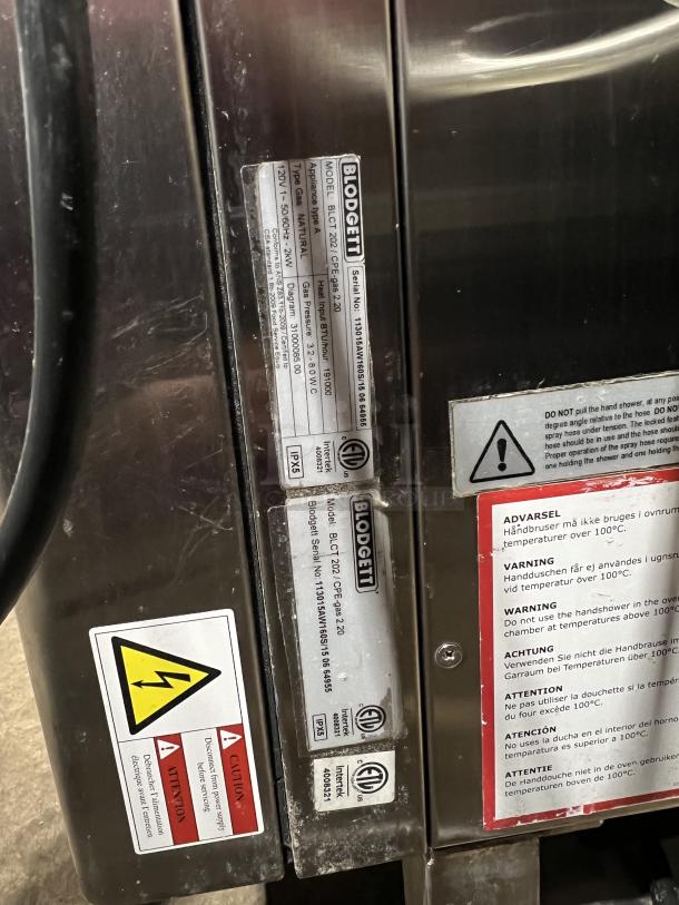 Blodgett BLCT202 combi oven, stainless steel, natural gas-powered, 120V 1 phase, on legs, model and safety labels visible.