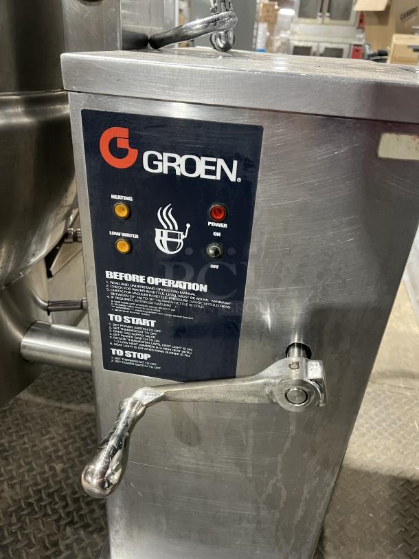 Groen DH140 stainless steel 40-gal tilting steam kettle, natural gas, control panel with instructions, on legs, serial 84256.