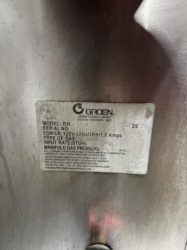 Groen Stainless Steel Natural Gas 40 Gal. Tilting Steam Kettle, Model DH140, Serial 84256, on legs, power 120V, 60Hz.