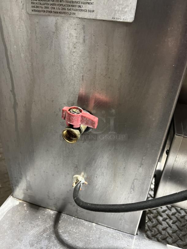 Groen Commercial 40 Gal. Tilting Steam Kettle, Model DH140, stainless steel, natural gas, on legs, visible connection valves.