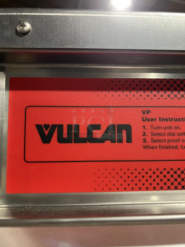 Vulcan VP18 commercial stainless steel heated holding cabinet, features universal pan slides, red label with user instructions.