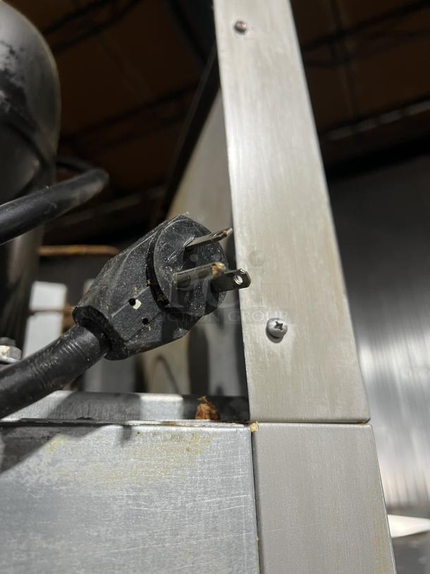 Power plug and metal corner detail of Beverage Air HF2-1S commercial refrigerator, showcasing construction quality.